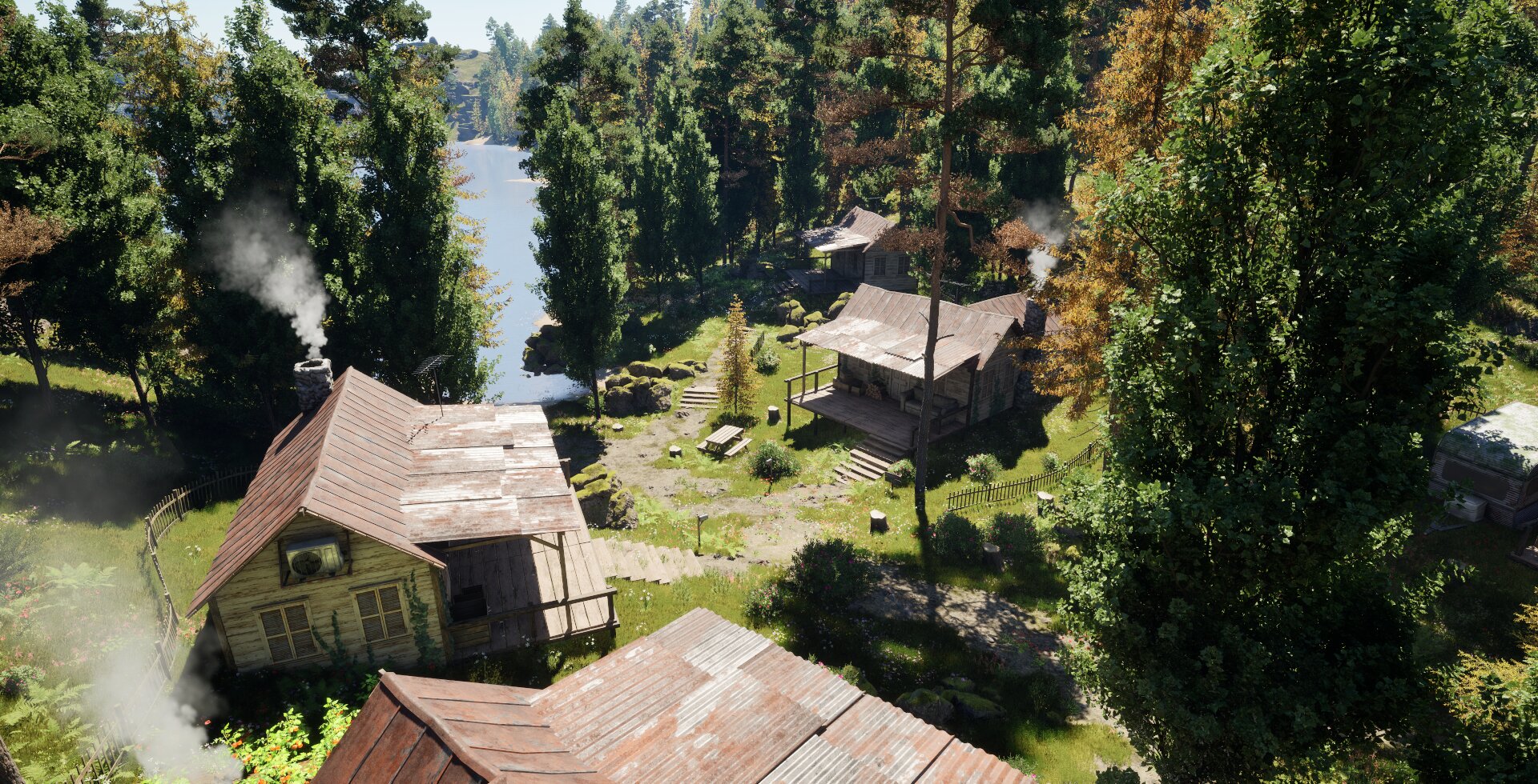 Vista panorámica del cluster de cabañas de Forest Cabins junto al lago.